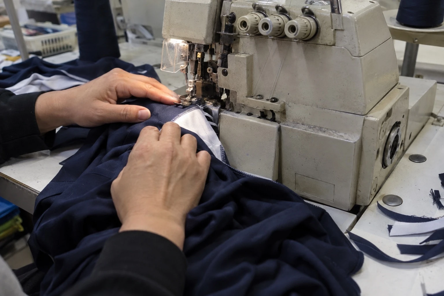 Illustration of an operator sewing a sportswear seam
